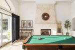 Gather in the game room for pool and enjoy the fireplace